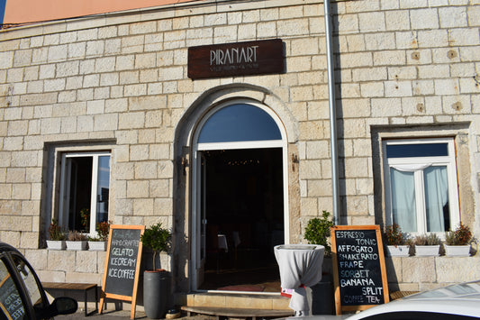 PiranArt exterior — white Istrian stone building on Piran waterfront